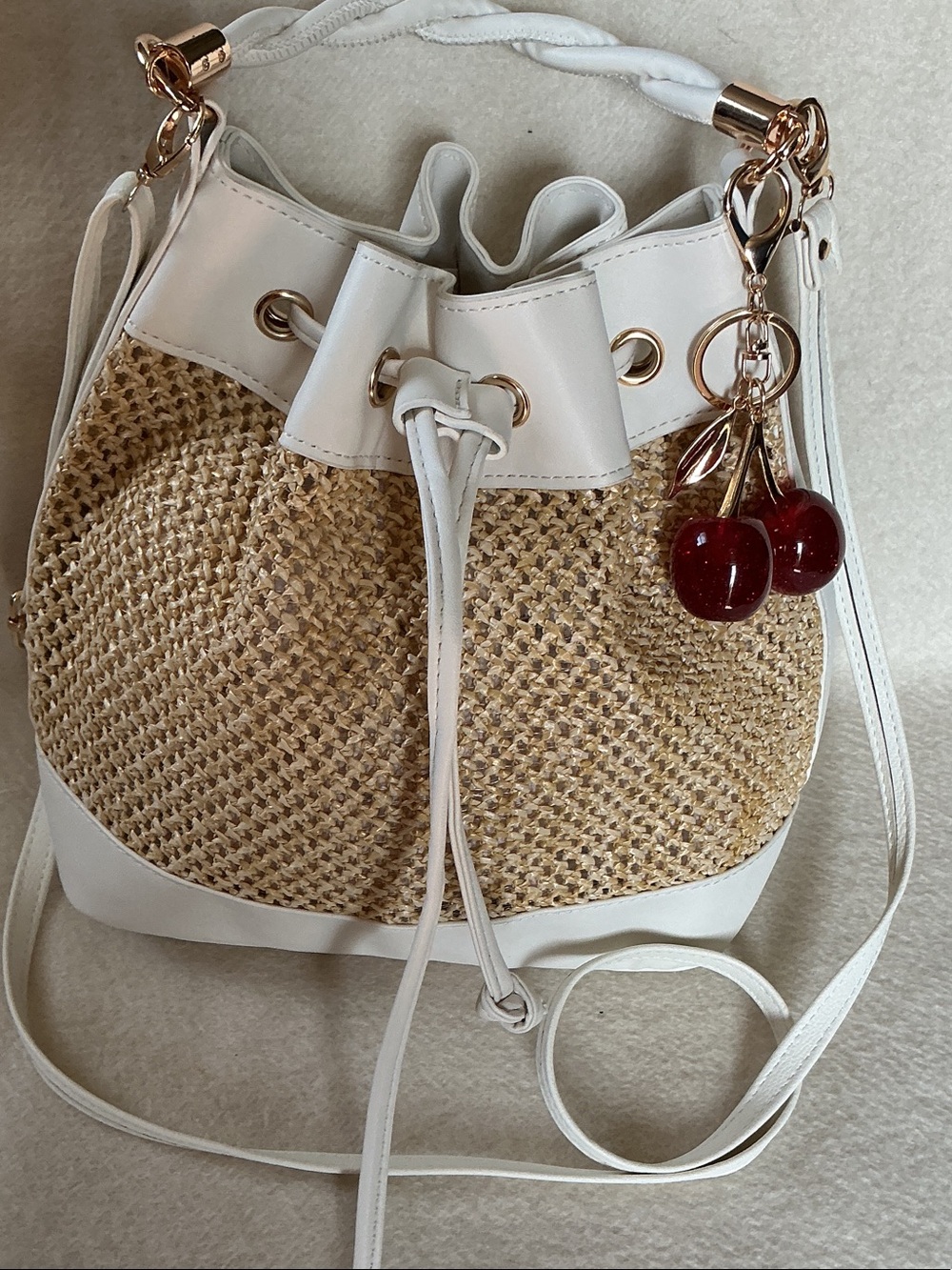 White-Trim Straw Crossbody Bucket Bag with Cherry Charm